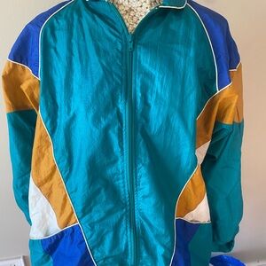 Vintage 90s Colorful Windbreaker Jacket. It is a baggy Medium
